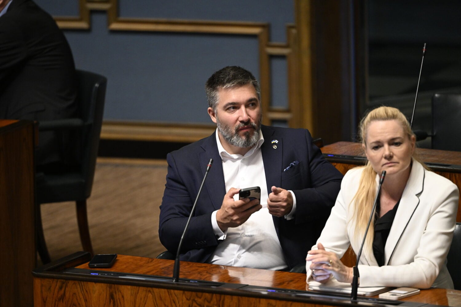 National Coalition Party MPs Tere Sammallahti and Milla Lähdenperä during a plenary session of Parliament. / LEHTIKUVA / JADE SILPO