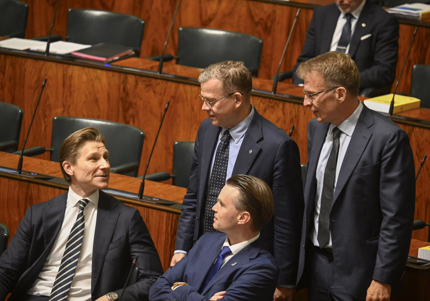 National Coalition Party Defence Minister Antti Häkkänen (left), Prime Minister Petteri Orpo, Heikki Autto and parliamentary group chair Jukka Kopra during a plenary session of Parliament in Helsinki on 29 September 2026. / LEHTIKUVA / MARKKU ULANDER