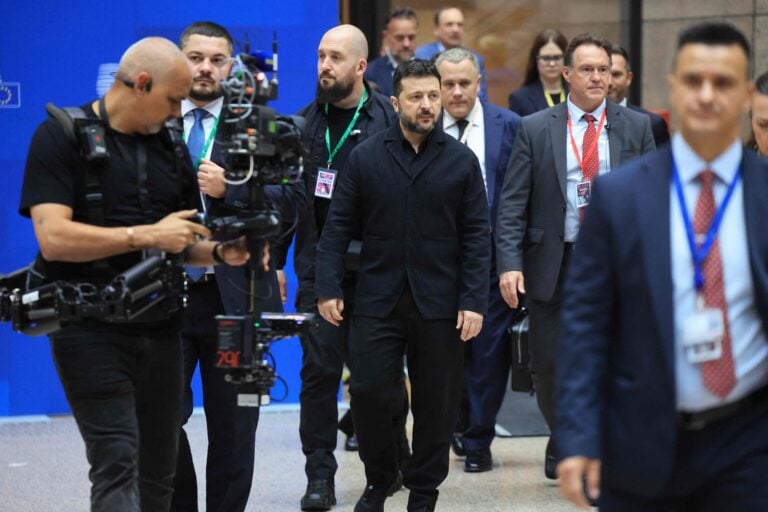 Ukraine's President Volodymyr Zelensky walks to address a press conference as part of a European Union summit at the EU headquarters in Brussels on October 16, 2026. / AFP / LEHTIKUVA / LUDOVIC MARIN