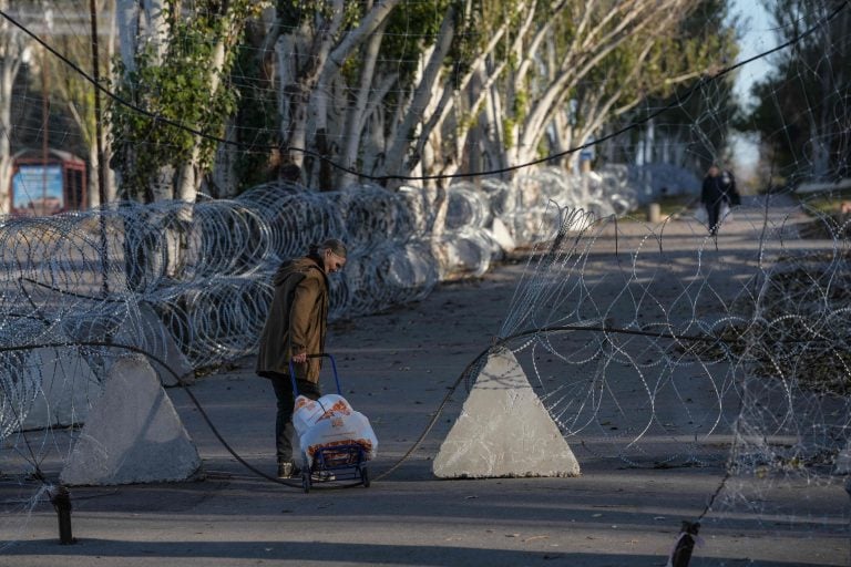 Local residents walking along a street protected with barbed wire and anti-drone nets in the frontline city of Kramatorsk, Donetsk region Ukraine. AFP PHOTO/LEHTIKUVA/ IRYNA RYBAKOVA / PRESS SERVICE OF THE 93RD KHOLODNYI YAR SEPARATE MECHANIZED BRIGADE